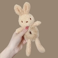 Cute beige plush bunny hair tie accessory shown being held for size scale - Rabbit Off-white