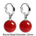 Elegant 925 sterling silver hoop earrings featuring a 12mm vibrant red agate round bead charm - Platinum + Red Agate