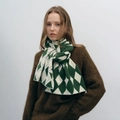Chic green and white diamond knit scarf for winter warmth styled on a model - Green & White
