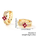 Detailed view of 1.5cm gold clover earrings with red stones and cubic zirconia - Gold/Red Flower