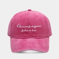 Close-up of pink washed cotton baseball cap with white Champagne Please embroidery - Adjustable / Rose Red