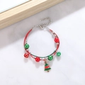 Close-up of a Christmas bracelet featuring enamel tree charm and festive woven cords - Style I Enamel Xmas Tree