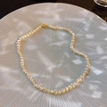 Baroque freshwater pearl necklace with irregular white pearls and a gold clasp - White Freshwater Pearl