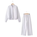 Dettaglio di una tuta grigia due pezzi con felpa con zip e pantaloni sportivi ampi - Taglia S / Top E Pantaloni / Grigio Melange Chiaro