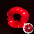 Luminous red LED scrunchie with soft fabric texture shown in glowing and off states - Glowing Red