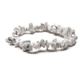Macro shot of white marble textured crystal chips on an elastic handmade bracelet - White Turquoise