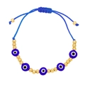 Detail of bohemian evil eye bracelet featuring gold beads and adjustable blue woven cord - Dark Blue