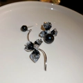 Detail of asymmetric dark style flower earrings with crystal accents and black pearls - Silver Needle-Black Asymmetric Flower Earrings
