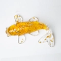 Yellow crystal goldfish figurine with gold foil flakes on white background - Citrine