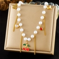 Korean style gold necklace with pearl chain, cherry and heart pendants on textured mat - Cherry Butterfly Heart Pearl Style (N3280)
