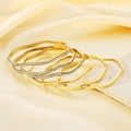 Elegant wavy gold bangles set with sparkling cubic zirconia on silky fabric base - 6Pcs Wave Stackable Set (KB187776 -LO)