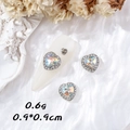 Aurora heart nail charm with silver edge and crystals on white silk background - Heart