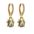 Detail of golden beetle drop earrings with navy blue crystals and zircon ear hoops - Gold Blue Zircon Beetle