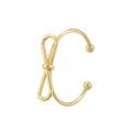 Dettaglio macro di un earcuff dorato a forma di fiocco con finitura lucida e piccole sfere - Ear Cuff Fiocco (VJ622 Oro)