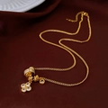 Elegant gold zircon flower pendant necklace with geometric beads on a velvet backdrop - Gold Zirconia Clover Luck Bead / Gold