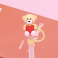 Pink 10mm silicone straw cover featuring a beige teddy bear holding a red heart topper - Bagged without Straw / Coffee Love Bear