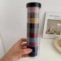 Close-up of seamless elastic hair ties in Morandi colors stored in a clear cylinder jar - Dark Series 20Pcs/Box