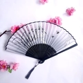 Bamboo folding fan with gray ink orchid pattern, black frame and charcoal tassel - Gray & White Gradient Ink Wash Orchid Style (Women's Fan-12)