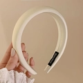 Close-up of white satin padded headband with black Hand Made woven label detail - Off-white