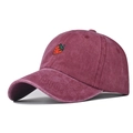 Close-up of vintage washed cotton baseball cap with strawberry embroidery in burgundy - Burgundy