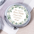 Silver portable makeup mirror with green leaf wreath and humorous quote print - Don't Do Stupid Funny