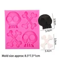 Pink silicone mold featuring 4 cavities for skull and crossbones fondant and chocolate - 2# 4-Hole Skeleton & Bones / Pink