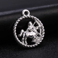 Macro detail of silver Sagittarius zodiac charm pendant with woven rope border on black leather - Style 3 / Antique Silver