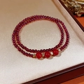 Detail of red garnet and southern red agate bracelet with gold accents in jewelry box - Southern Red Agate & Garnet Double Loop Bracelet (Exquisite Gift Box)