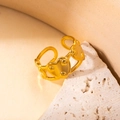 Elegant gold titanium steel heart ring with polished finish on a natural stone base - Heart Gold 47
