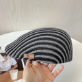 Close-up of black and white striped knit beret featuring a brown leather RF logo badge - M(56-58cm) / Black & White Stripes