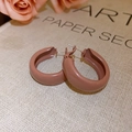 Close-up of pink-brown C-shaped vintage earrings on a retro book background - Pinkish Coffee (Style 8 Glossy C-Shape)