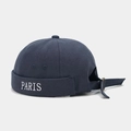 Detail of PARIS embroidery and adjustable metal buckle on navy canvas docker cap - Dark Gray