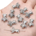 Silver goldfish alloy pendant beads for DIY jewelry making held in a hand - Goldfish / 11x14mm