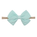 Soft mint green polka dot bow headband for infants made of stretchy beige nylon - Mint Green