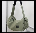 Olive green crescent fitness bag with adjustable strap and square XX patch detail - Green