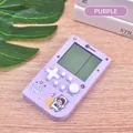 Retro purple handheld tetris game machine with astronaut space theme on wood table - Astronaut / Orchid Purple