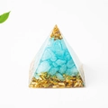 Blue crystal and gold foil resin Orgone Pyramid energy generator on white background - 3cm / Aquamarine