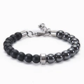 Macro shot of 8mm matte black and hematite beads with a silver stainless steel clasp - Magnetic Stone Bracelet