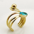 Golden chain ring with oval blue gemstone and triple-layered wrap design on white background - One Size / Blue Spiral Gem Style (R0386-02-blue)