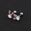Macro detail of cute white rabbit enamel stud earrings with secure screw-back design - Cat / Steel