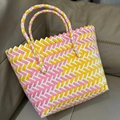 Pink yellow and white hand-woven tote bag with dual handles on a leather background - Small (No Bow) / Yellow-Pink