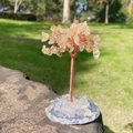 Handmade wire tree of life figurine with yellow crystal leaves on a clear stone base - Citrine