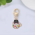Detail of enamel cat charm in floral teacup with golden heart-shaped lobster clasp - White Flower Cup Cat