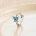 Silver butterfly hoop earring with blue and clear zircon crystals on beige surface - Silver Blue (Single)