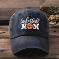 Vintage washed black cotton baseball cap with Basketball MOM white embroidery on wood desk - One Size / Black