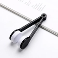 Portable eyeglass cleaning clip with black plastic holder and white microfiber pads - Black