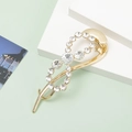 Elegant gold frog hair clip with sparkling rhinestones on a geometric background - B3531-4# Rhinestone Streamline