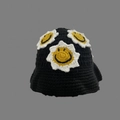 Detail of hand-knitted black fisherman hat featuring white flower and yellow smile patterns - One Size / Six Sunflowers Hat
