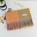 Cashmere blend scarf featuring orange and tan color blocks with colorful long tassels - Turmeric