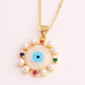 Detail of golden Evil Eye pendant with colorful zircon stones and faux pearls - Pearl Evil Eye Style (XL198-3)